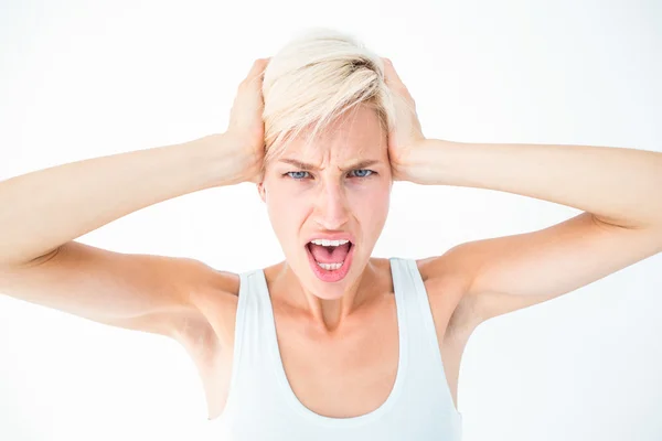 Angry woman screaming and holding her head — Stock Photo, Image