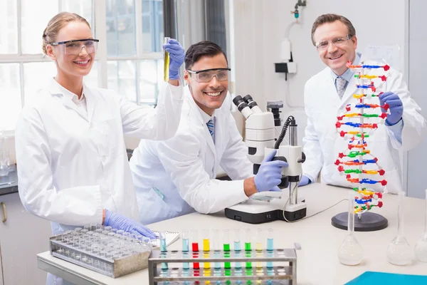Smiling scientists looking at camera — Stock Photo, Image