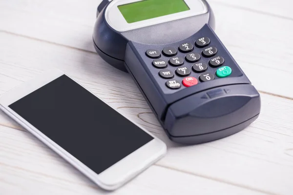 Overhead of pin terminal and smartphone — Stock Photo, Image