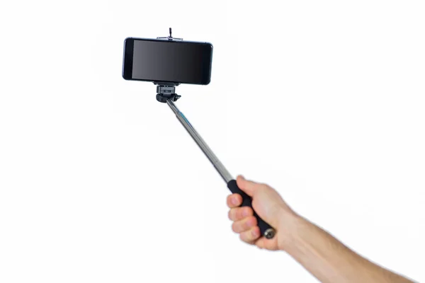 Člověk s použitím selfie hůl — Stock fotografie