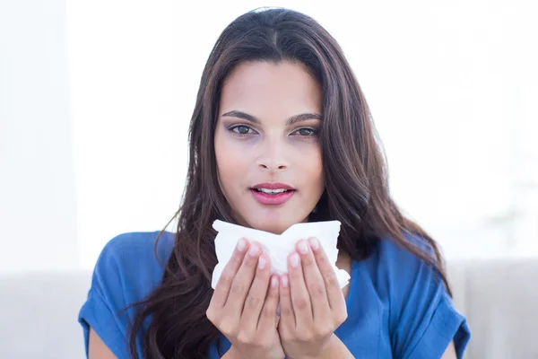 Sick brunette blowing her nose — Stock Photo, Image