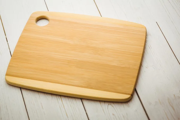 Wooden board on a table — Stock Photo, Image