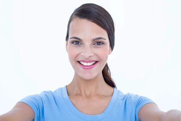 Pretty brunette smiling at camera — Stock Photo, Image