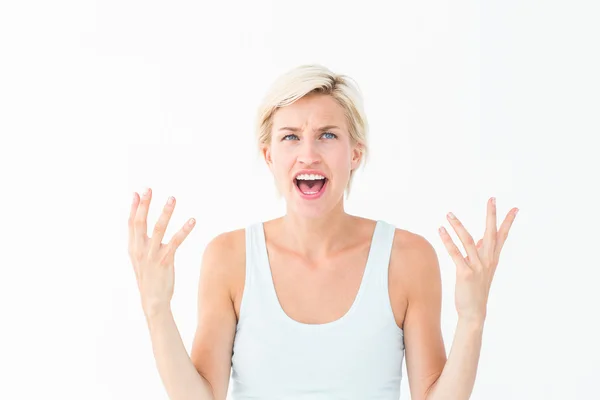 Angry blonde yelling with hands up — Stock Photo, Image