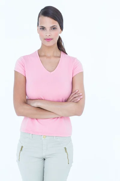 Serious woman looking at camera with arms crossed — Stock Photo, Image