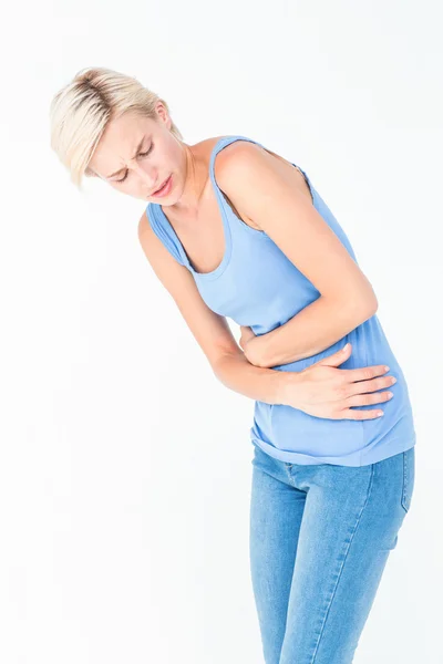 Příležitostné ženě s bolestmi žaludku — Stock fotografie