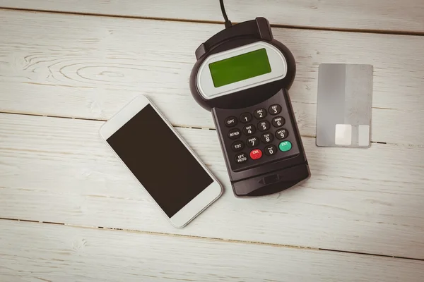 Overhead of pin terminal and smartphone — Stock Photo, Image