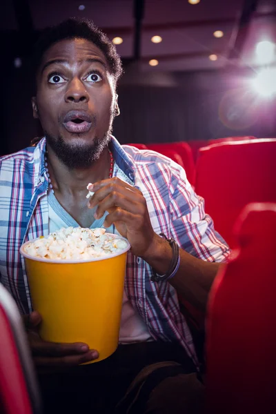 Young man watching a film — Stock Photo, Image