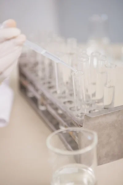 Scientist analyzing test tube — Stock Photo, Image