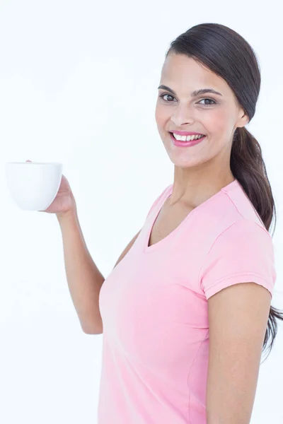 Pretty brunette holding coffee cup — Stock Photo, Image