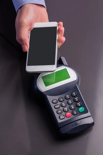 Man using smartphone to express pay — Stock Photo, Image