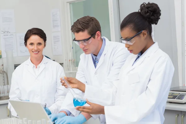 Scientists working together on precipitate tests — Stock Photo, Image