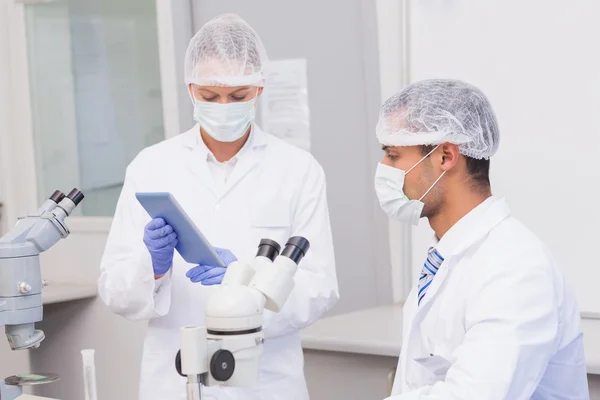 Scientists using tablet pc — Stock Photo, Image