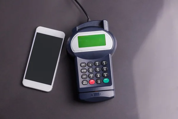 Overhead of pin terminal and smartphone — Stock Photo, Image