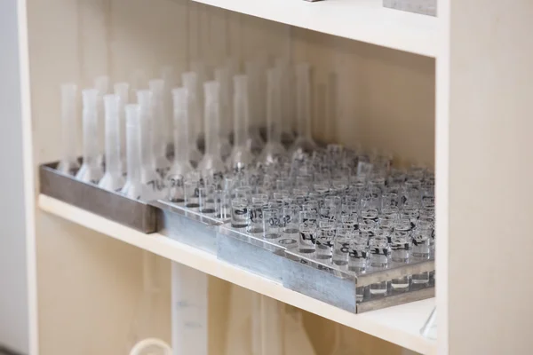 Tray with test tubes at the shelf — Stock Photo, Image