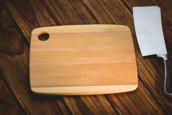 Chopping board with large knife — Stock Photo, Image