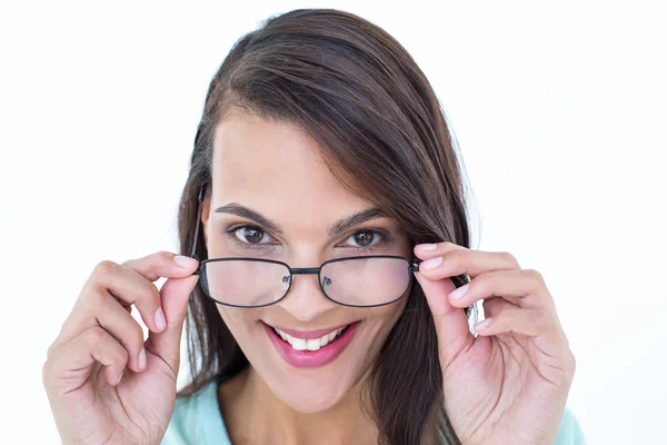 Pretty woman holding her eyeglasses — Stock Photo, Image