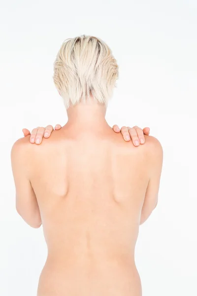 Beautiful topless woman touching her shoulders — Stock Photo, Image