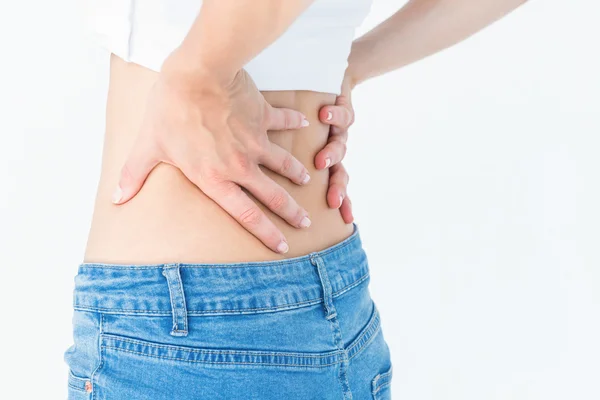 Mujer sufriendo de dolor de espalda — Foto de Stock