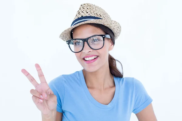 Smiling woman making peace and love gesture — Stock Photo, Image