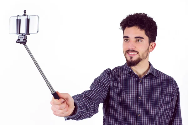 Casual homem usando uma vara selfie — Fotografia de Stock