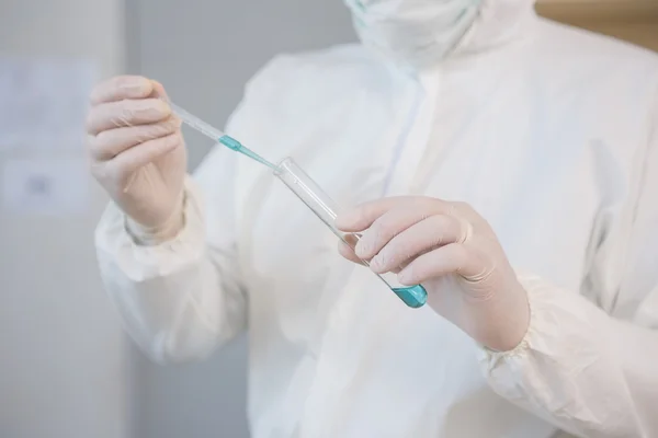 Scientist injecting tube — Stock Photo, Image