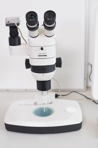 Microscope on a desk Royalty Free Stock Images