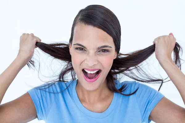 Furious woman pulling her hair Royalty Free Stock Photos
