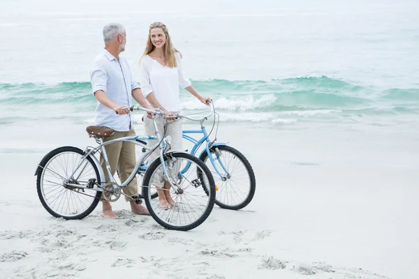 Happy couple cycling together — Stock Photo, Image