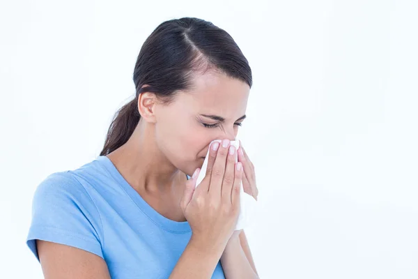 Sick woman blowing her nose — Stock Photo, Image