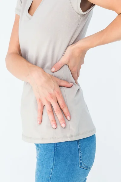 Mujer sufriendo de dolor de espalda — Foto de Stock