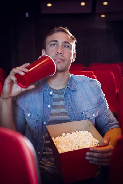 Young man watching a film — Stock Photo, Image