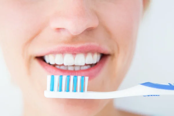 Pretty woman holding toothbruch — Stock Photo, Image