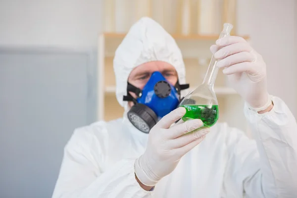 Scientist in examining green precipitate — Stock Photo, Image