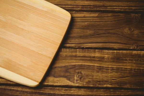 Placa de madeira em uma mesa — Fotografia de Stock
