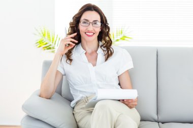 Smiling therapist taking notes clipart