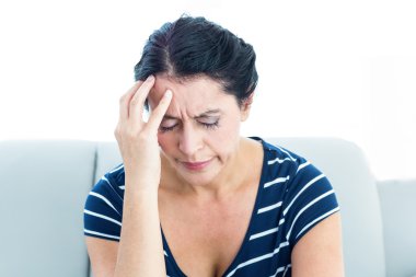 Woman having migraine clipart
