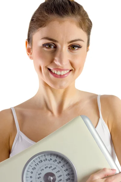 Slim woman holding weighing scales — Stock Photo, Image