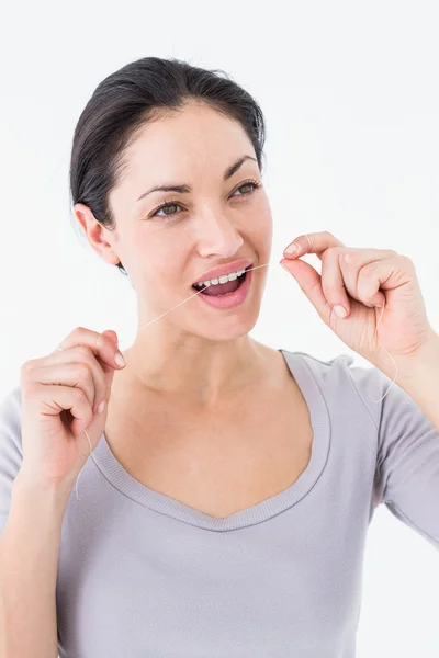 Mujer usando hilo dental —  Fotos de Stock