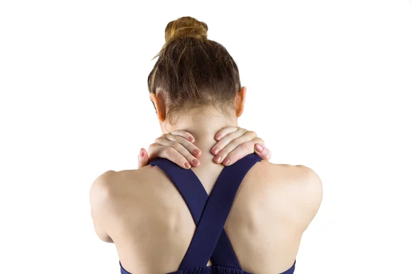 Fit brunette woman with neck injury — Stock Photo, Image