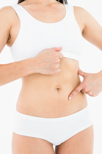 Mujer en forma tocando su doloroso estómago — Foto de Stock