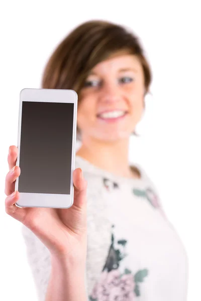 Pretty brunette holding her smartphone and looking at camera — Stock Photo, Image