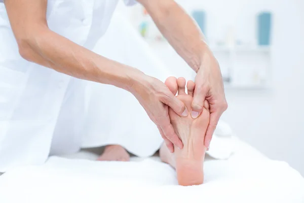 Physiotherapist doing foot massage — Stock Photo, Image