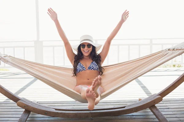 Pretty brunette relaxing on a hammock — Stock Photo, Image