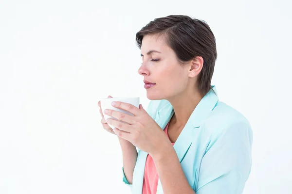 Peaceful woman drinking cup of coffee — Stock Photo, Image