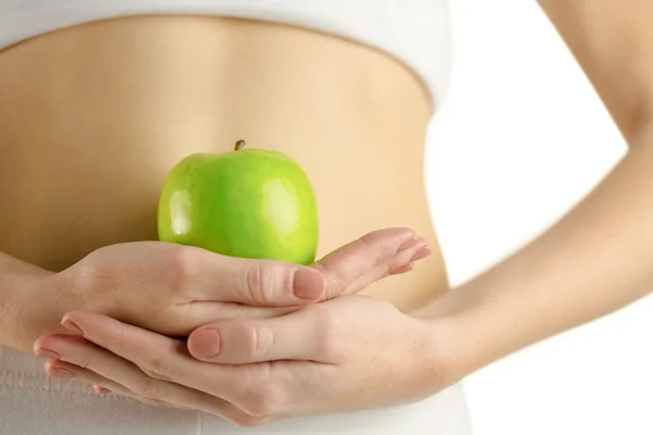 Slim woman holding green apple — Stock Photo, Image