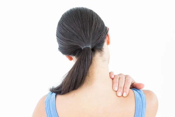 Attractive brunette with neck pain — Stock Photo, Image