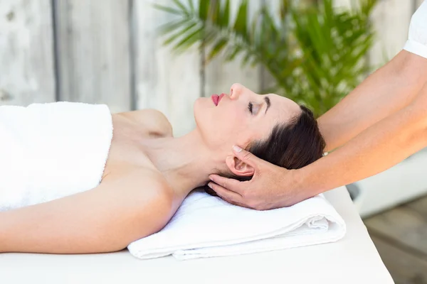 Brunette receiving head massage — Stock Photo, Image