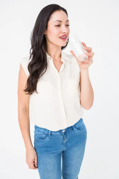 Pretty brunette drinking water — Stock Photo, Image