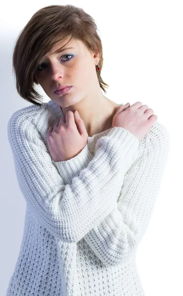 Sad pretty brunette with arms crossed — Stock Photo, Image